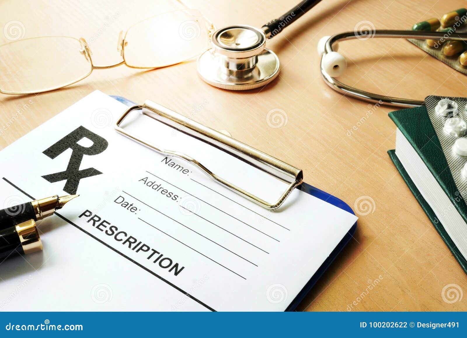 doctorÃ¢â¬â¢s table with medical prescription form.